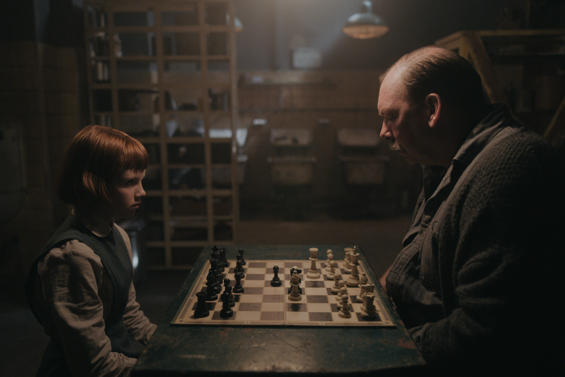 ISLA JOHNSTON as BETH (ORPHANAGE) and BILL CAMP as MR. SHAIBEL in episode 101 of THE QUEEN&#x27;S GAMBIT