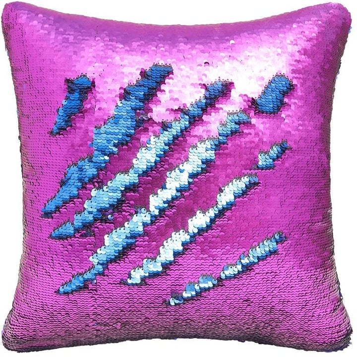 An all-over sequins pillow with "flippable" sequins; run your hand in one direction and they're purple, the other direction, they're blue