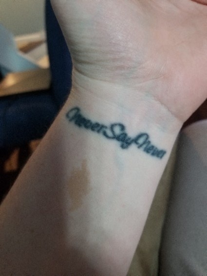 A tattoo that says, &quot;Never Say Never&quot; on the inside of someone&#x27;s wrist