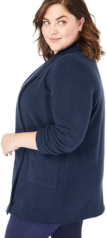 A model wearing the cardigan in navy