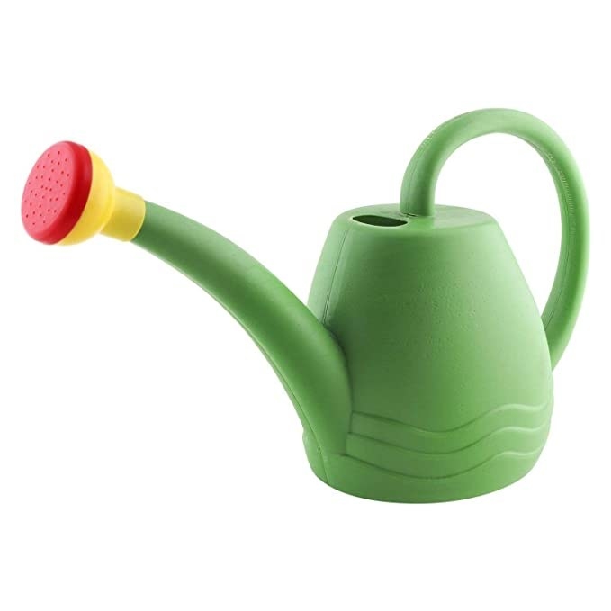 Green watering can with a red and yellow hose tip.