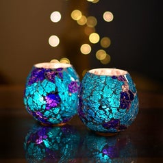A pair of blue candle holders.