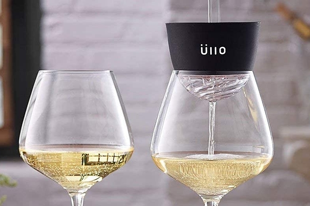 wine being poured through the ullo into a glass