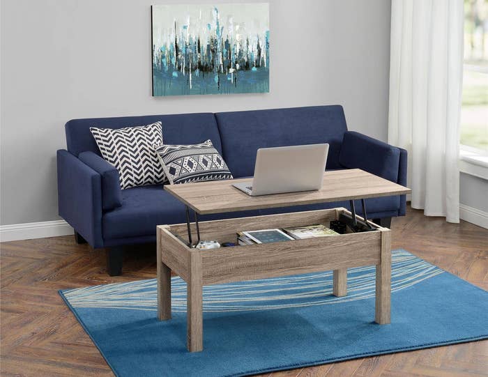 The brown lift-top coffee table