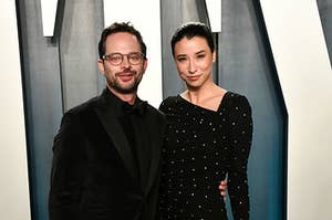 Nick Kroll and Lily Kwong posing together at the Vanity Fair Oscars party