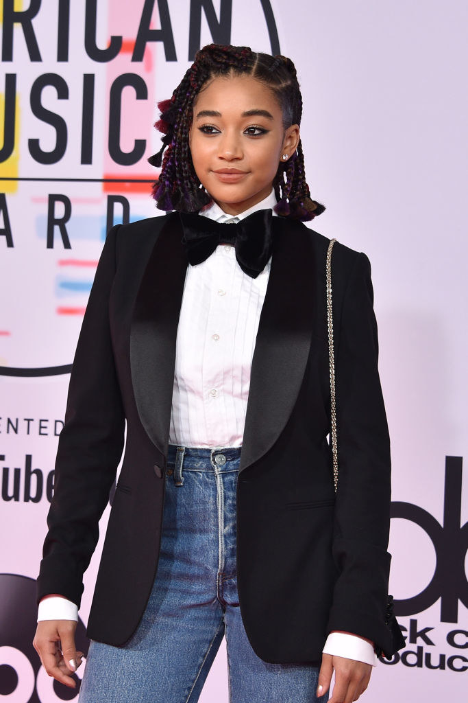 tuxedo jacket and shirt with a bowtie and high waist jeans