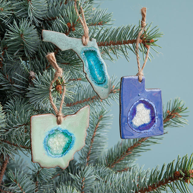 Blue geode ornaments shaped like states 