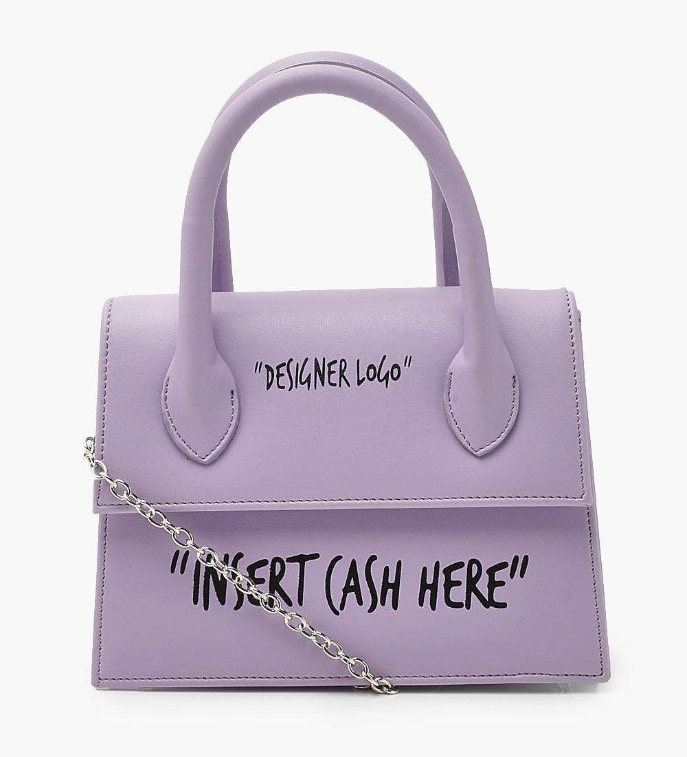 purple purse that sayd "designer logo" and "insert cash here" in black letters