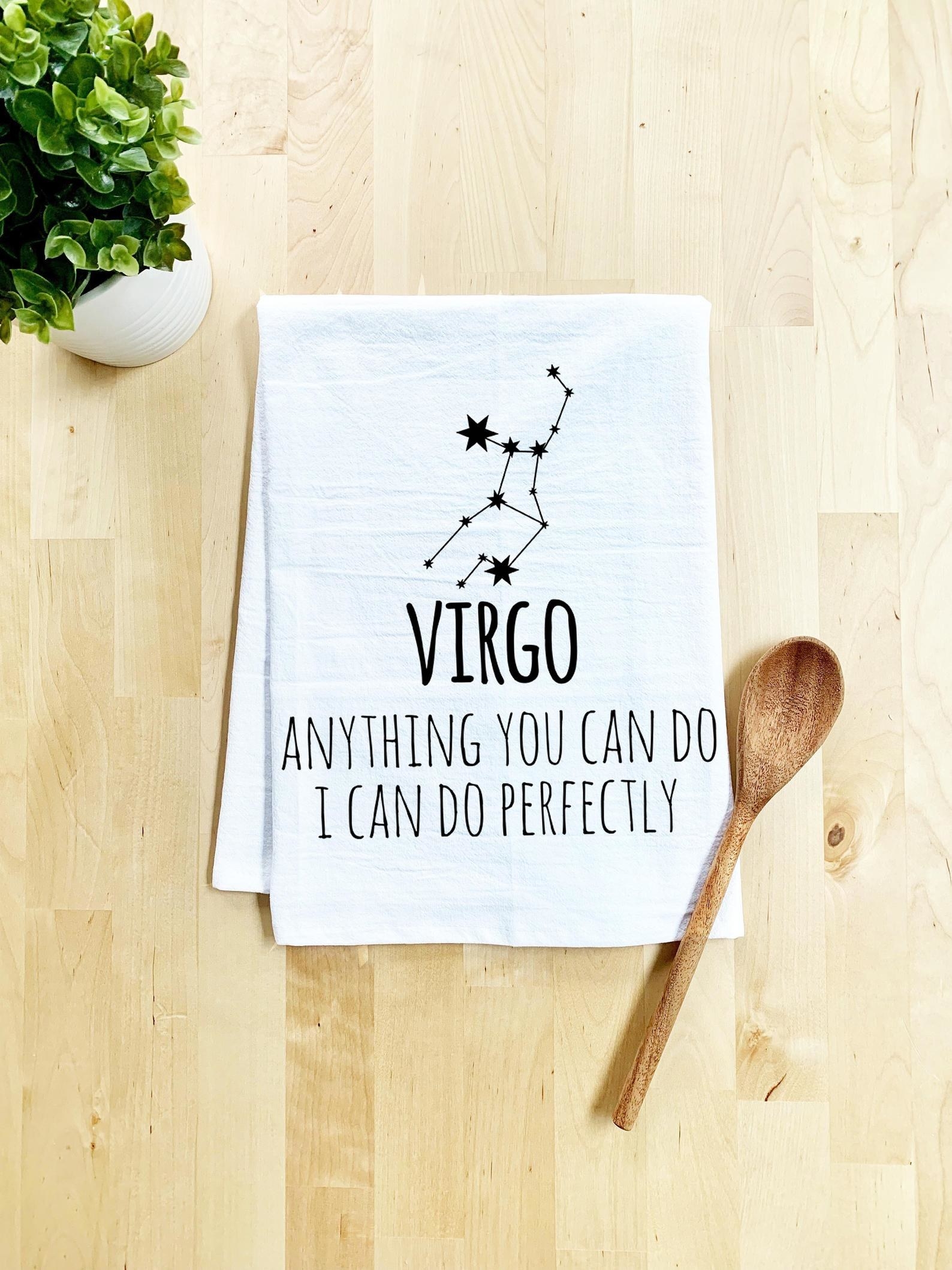 A white tea towel that says &quot;Virgo: anything you can do I can do perfectly&quot; 
