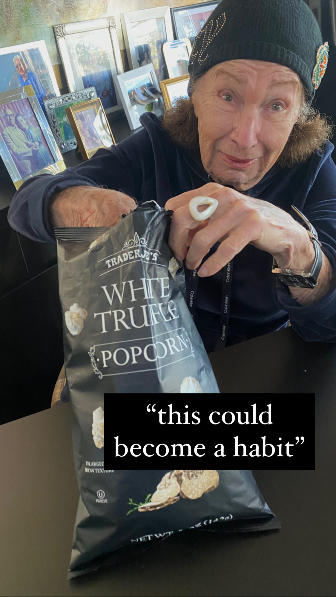 My grandma digging into a bag of truffle popcorn.