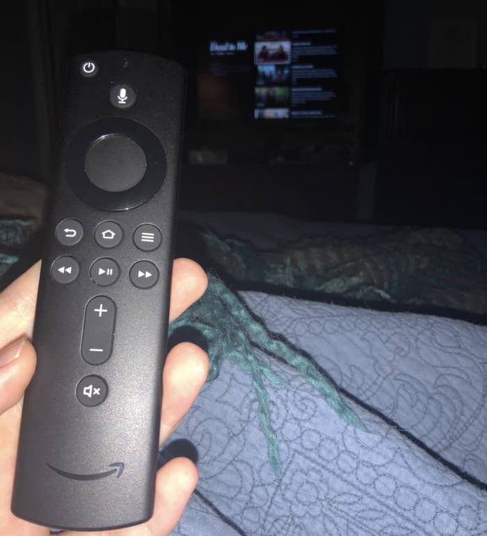 reviewer holding fire stick