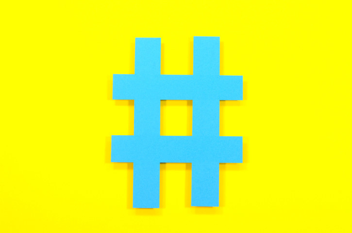 HashTag sign shown on yellow background