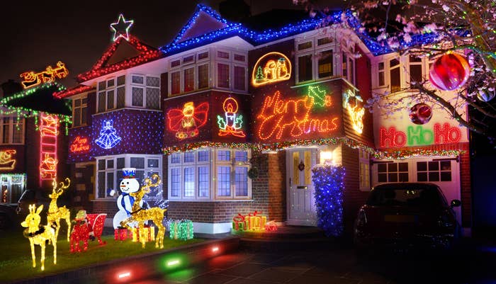 The exterior of a house covered in Christmas decorations 