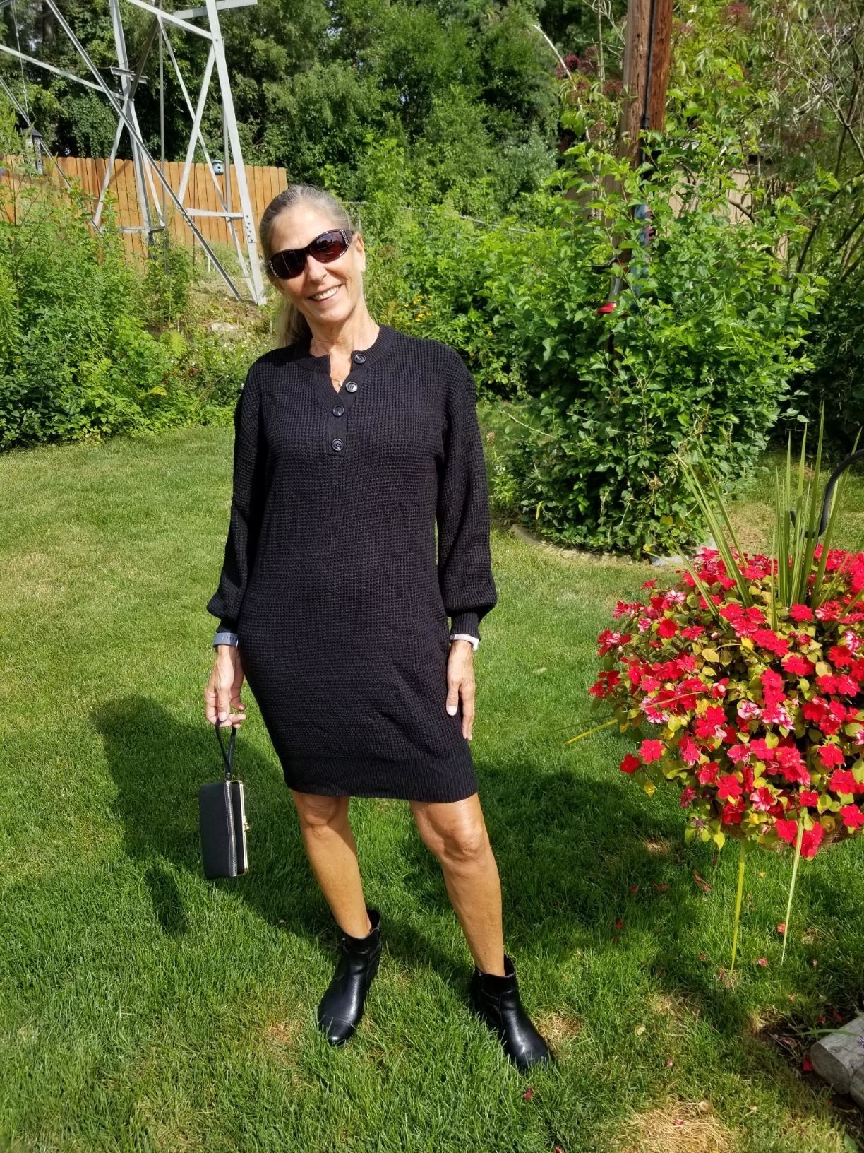 A different reviewer wearing the dress in black