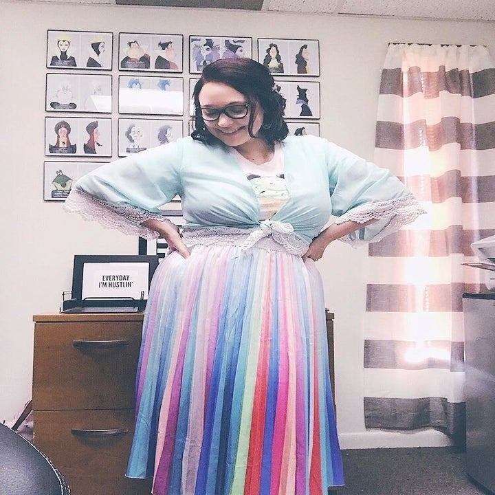 A different reviewer wearing the skirt with a vertical rainbow ombre print to it