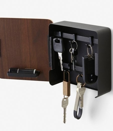 various keys hanging in the magnetic key cabinet