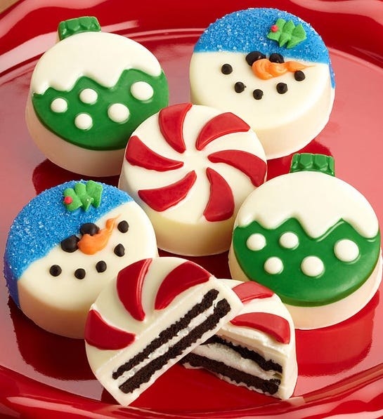 Six round cookies with festive mints, snowman, and ornament chocolate details 