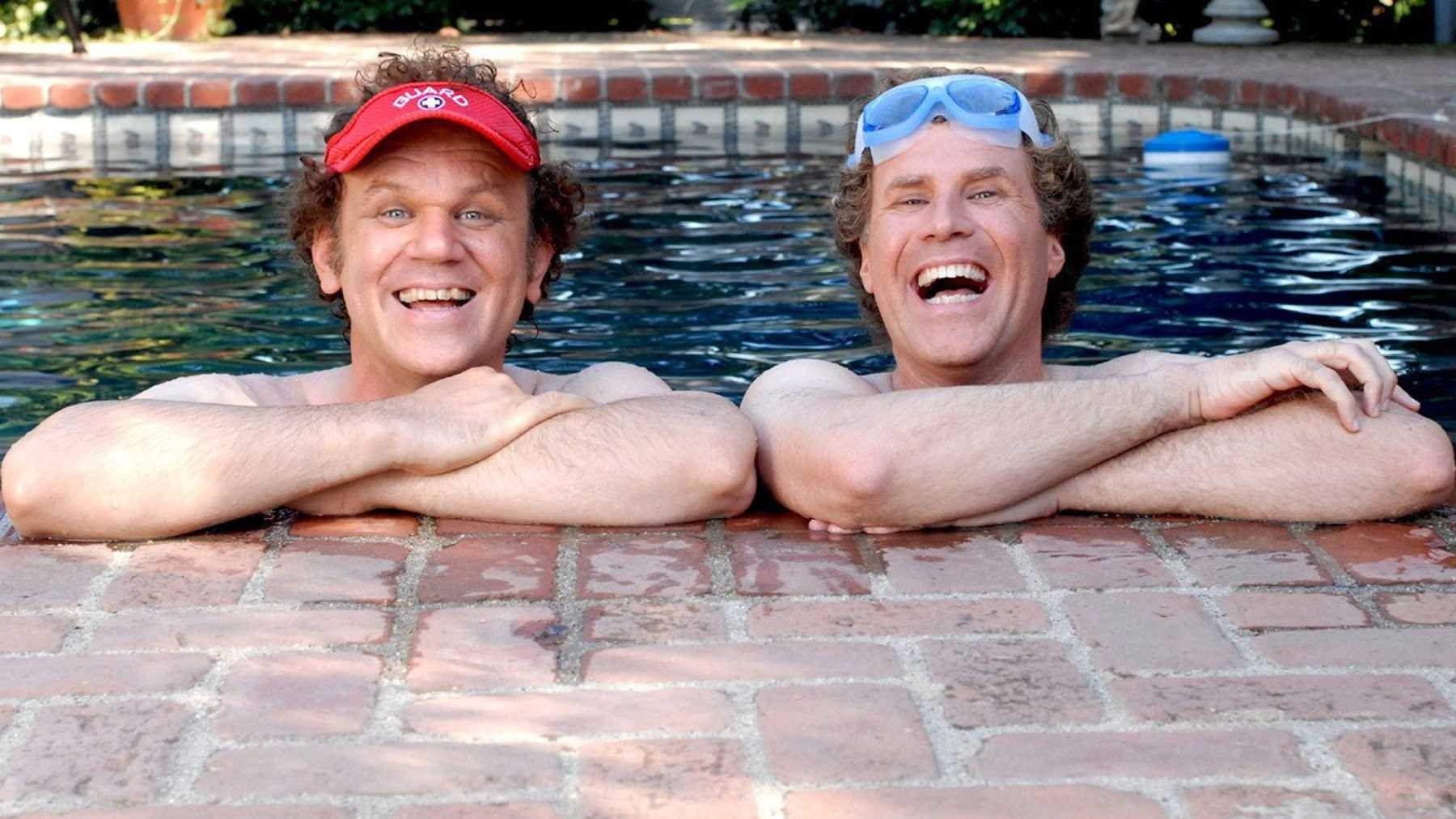 Dale Doback (John C. Reily) and Brennan Huff (Will Ferrell) leaning against the side of a pool
