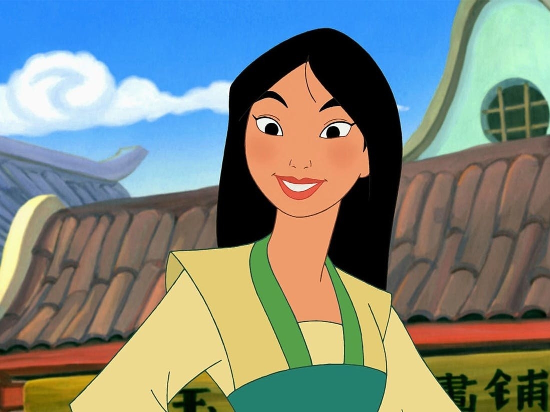 Mulan with her hands on her hips, smiling
