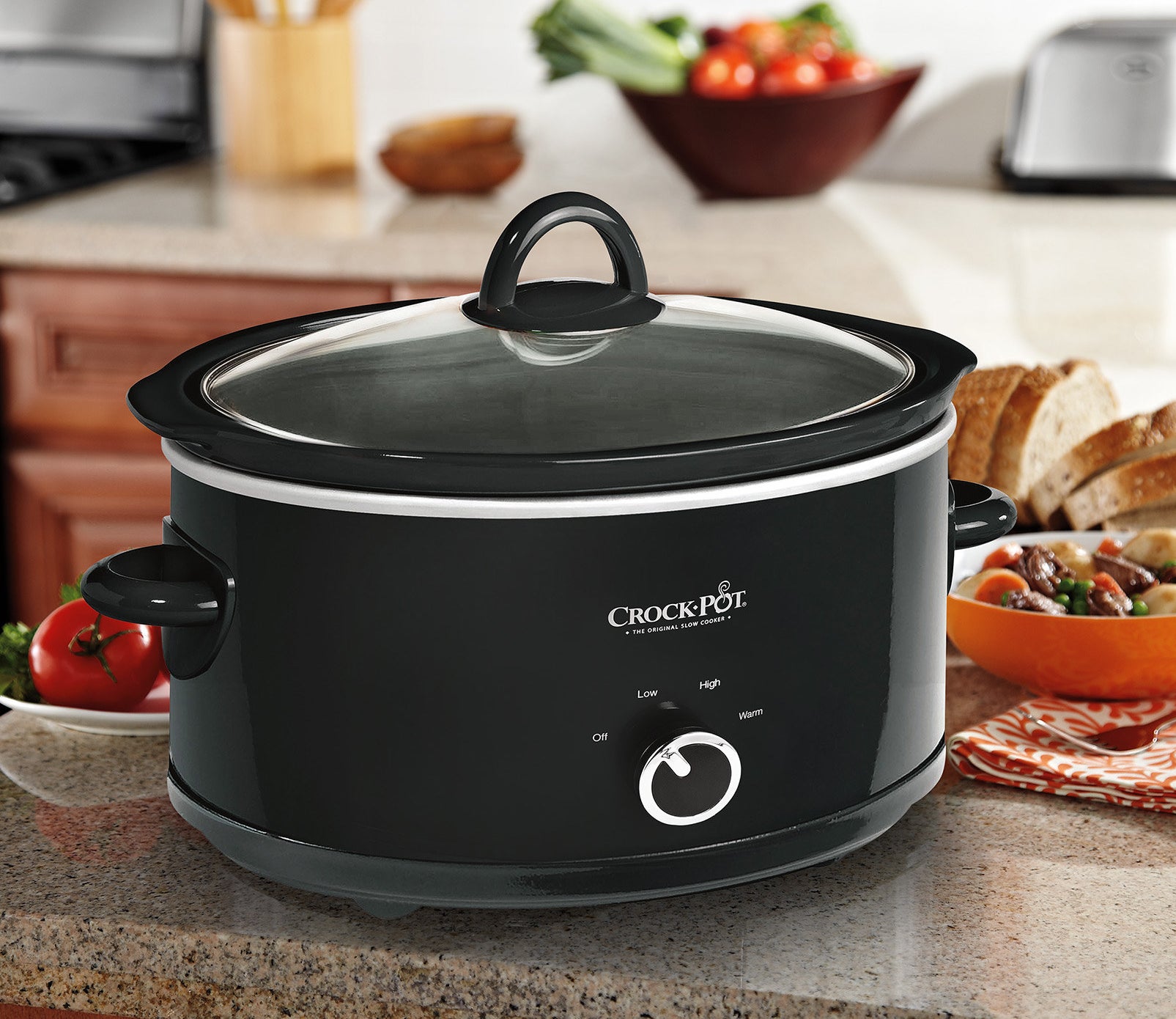 the crock pot in the kitchen with food next to it 