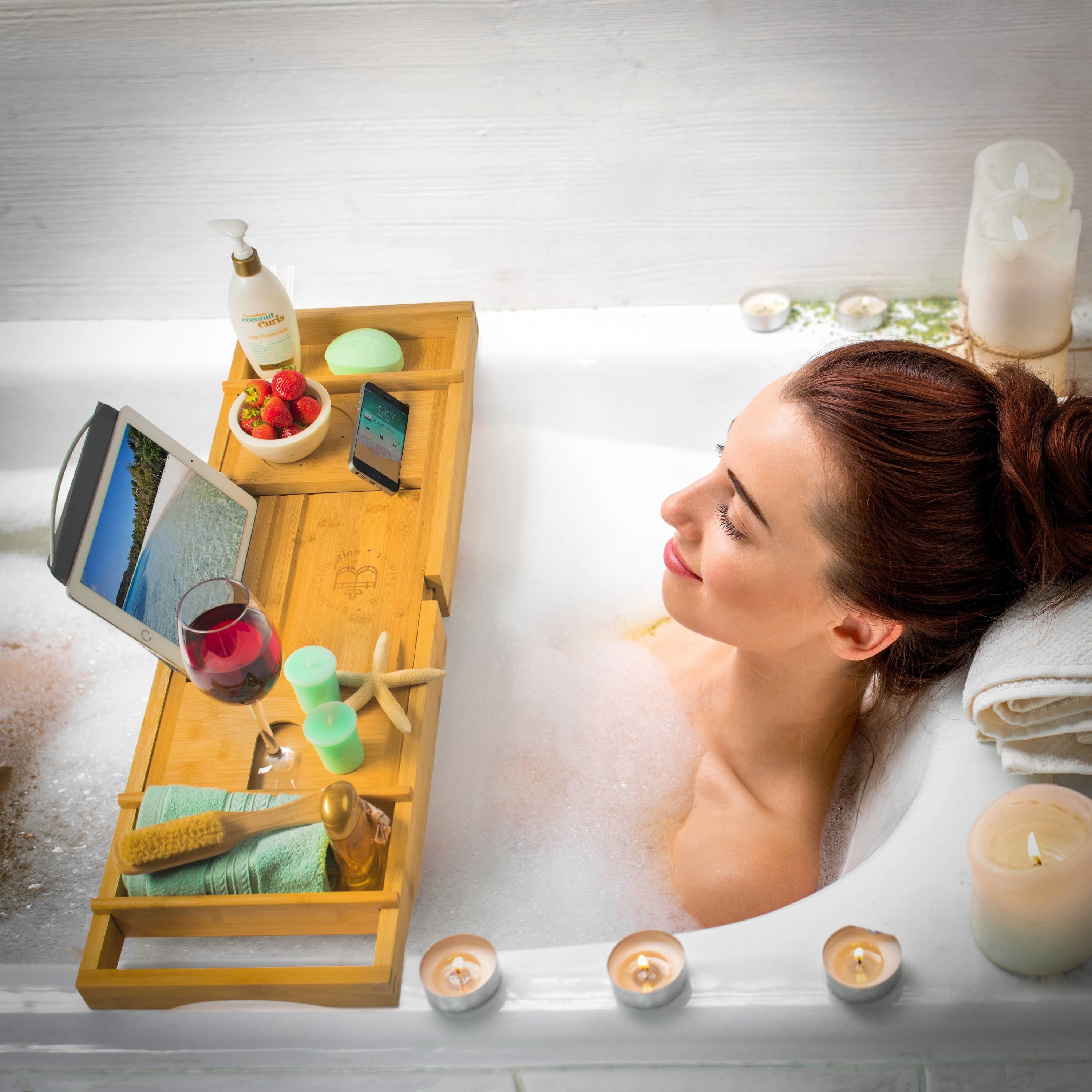 a model relaxing in the bath and using the bath tray