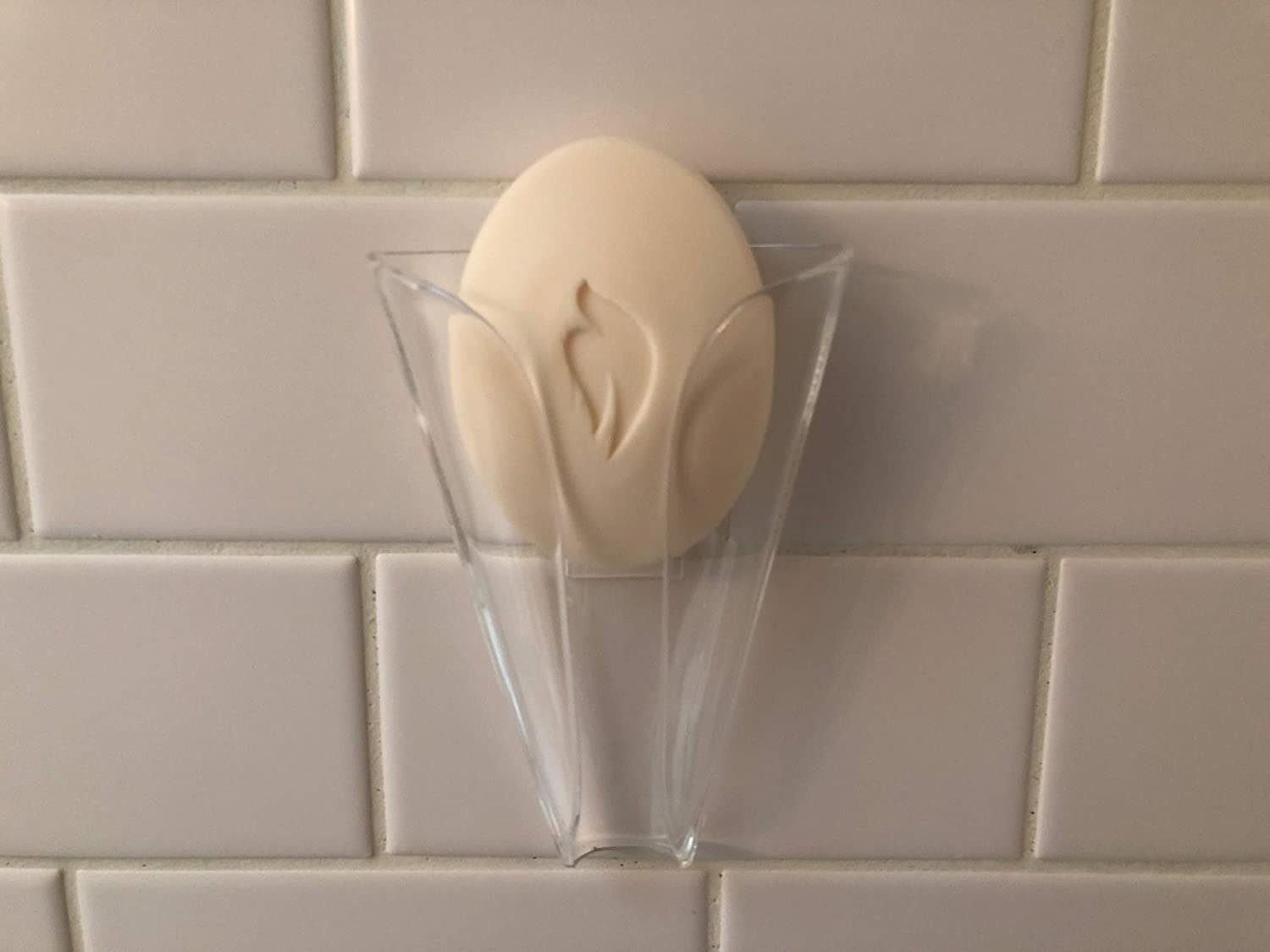 A bar of soap in the transparent soap holder