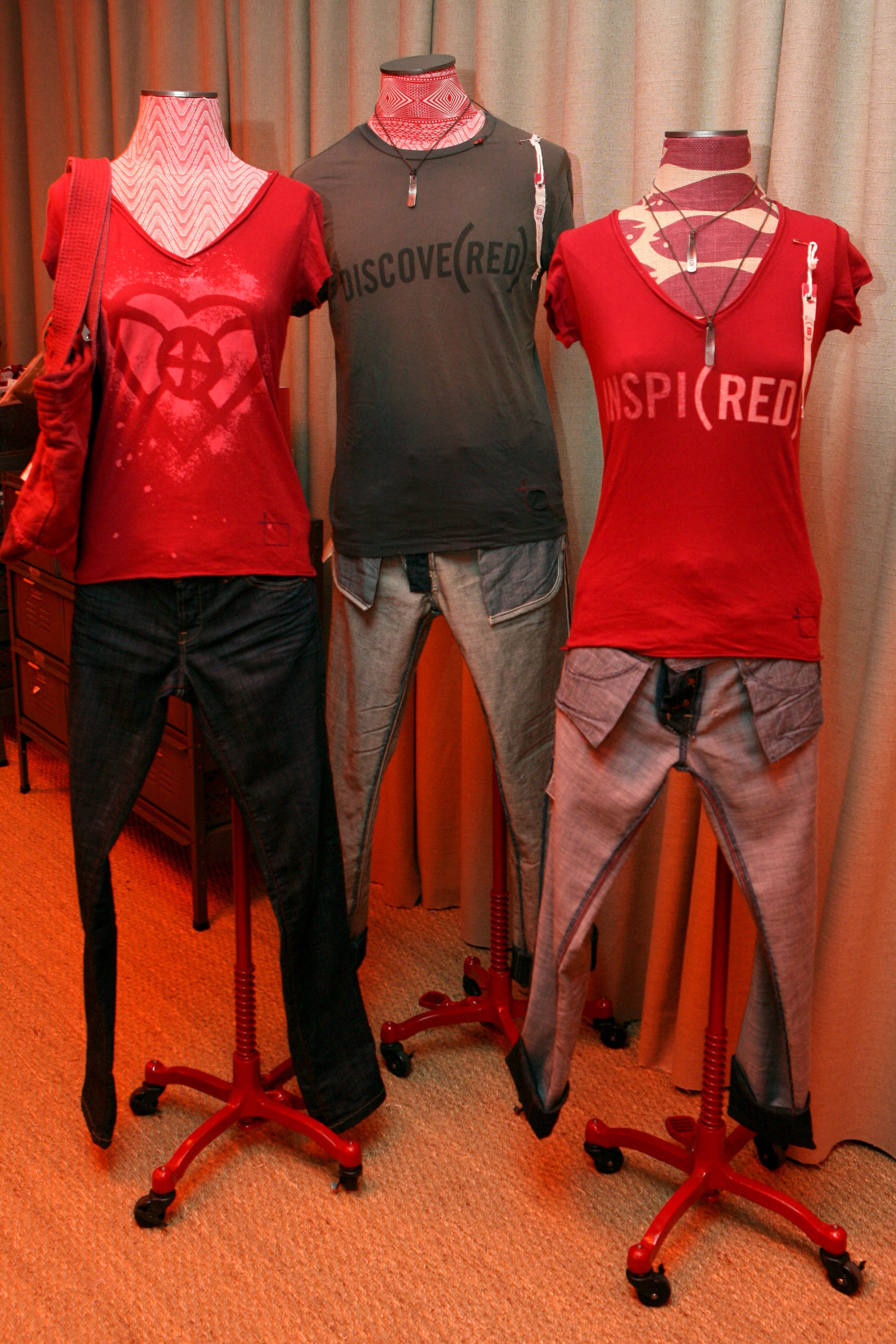 Three T-shirts from Gap&#x27;s collaboration with Product Red on dress forms