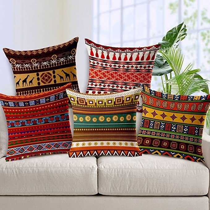 Multicoloured cushion covers with an ethnic Aztec print.