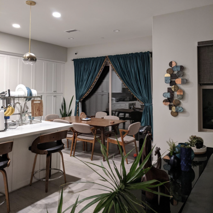 Reviewer photo of teal drapes hanging from kitchen window