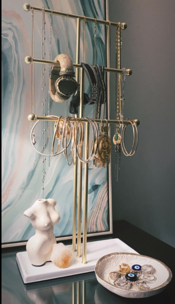 Reviewer photo of vase next to jewelry holder on a table