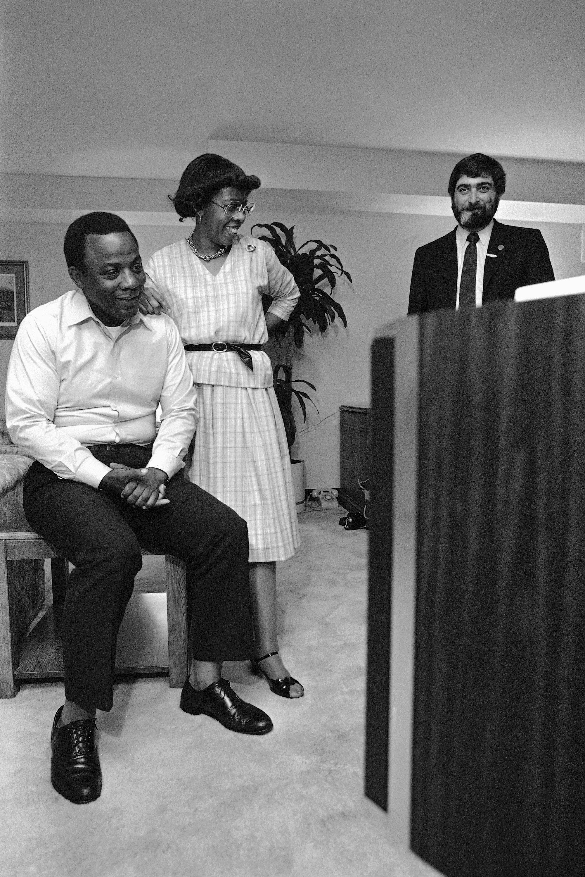 Man and woman watching election returns on television 