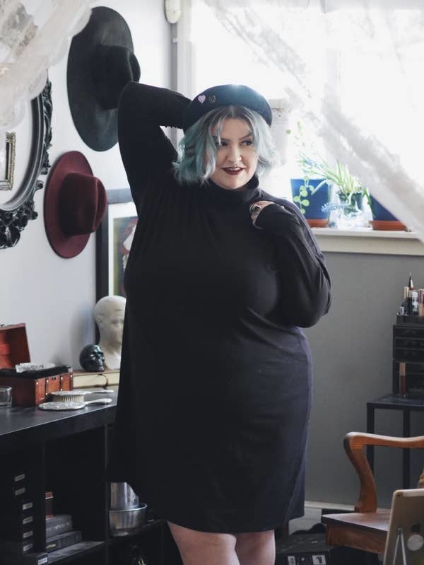 Reviewer modeling the black dress