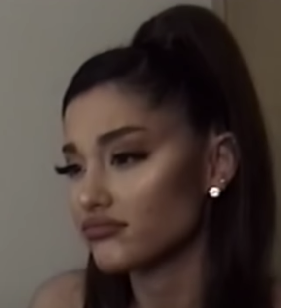 Ariana making a shady pout face