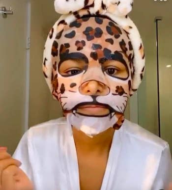A customer review photo of them wearing the leopard face mask.