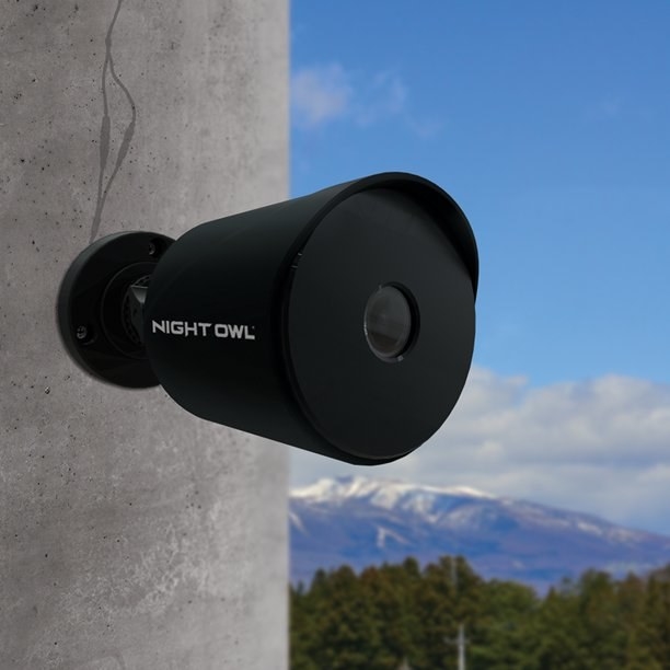 One of the cameras, which are small and black, and can be mounted on a wall