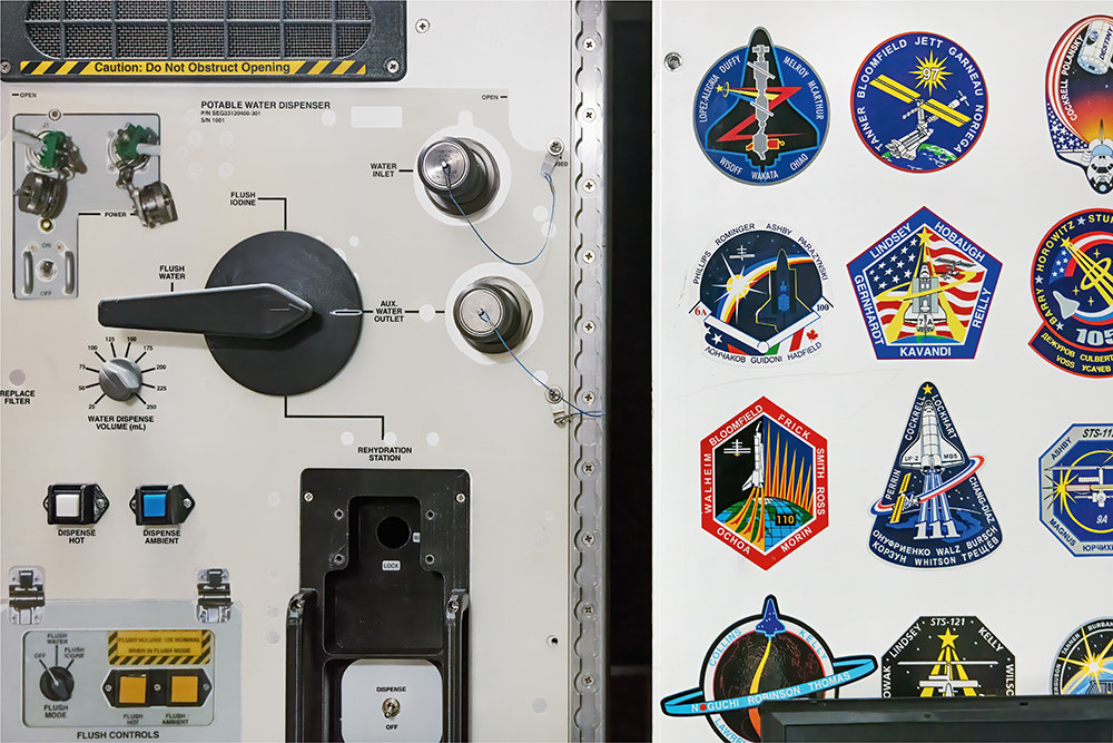 A door with a water dispenser covered in patches