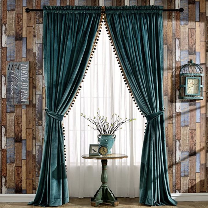 Photo of teal drapes hanging from window
