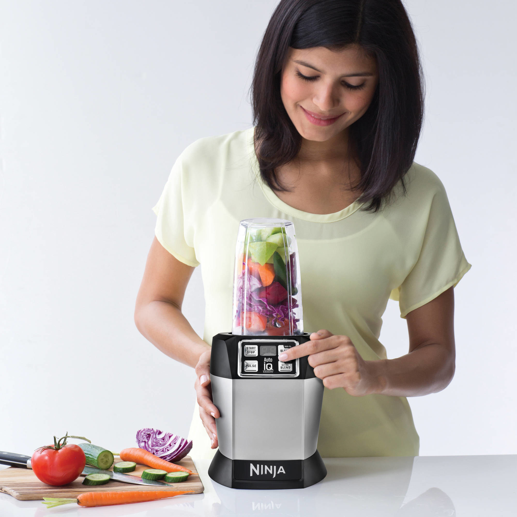 A model blending vegetables in the blender