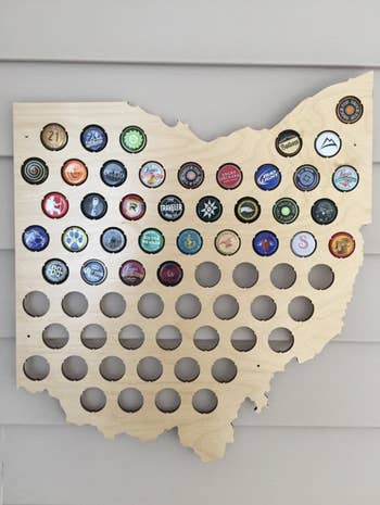 Reviewer image of their map half filled with bottle caps