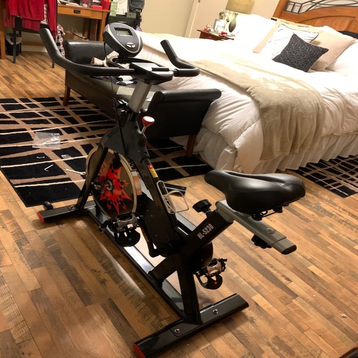 Reviewer shows same stationary bike in their bedroom