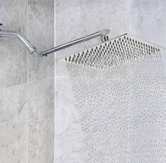 Rainshower shower head appliance in use