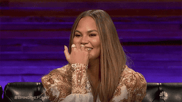 GIF of Chrissy laughing on the NBC show, &#x27;Bring the Funny&#x27;