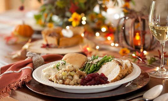 Place setting of food at a Thanksgiving dinner.