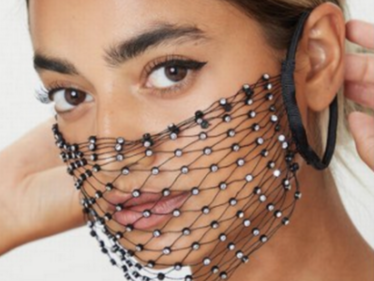 A model wears a useless fishnet mask