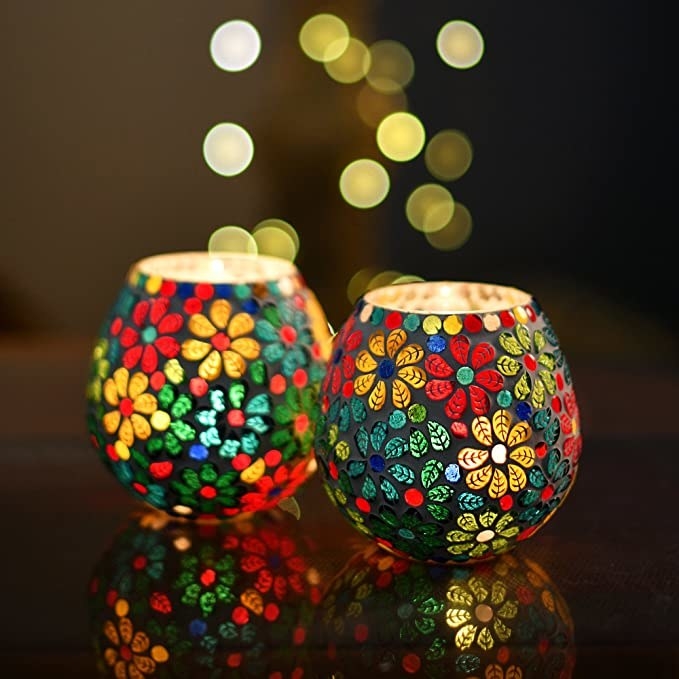 Mosaic glass candle holders with a stunning floral design.