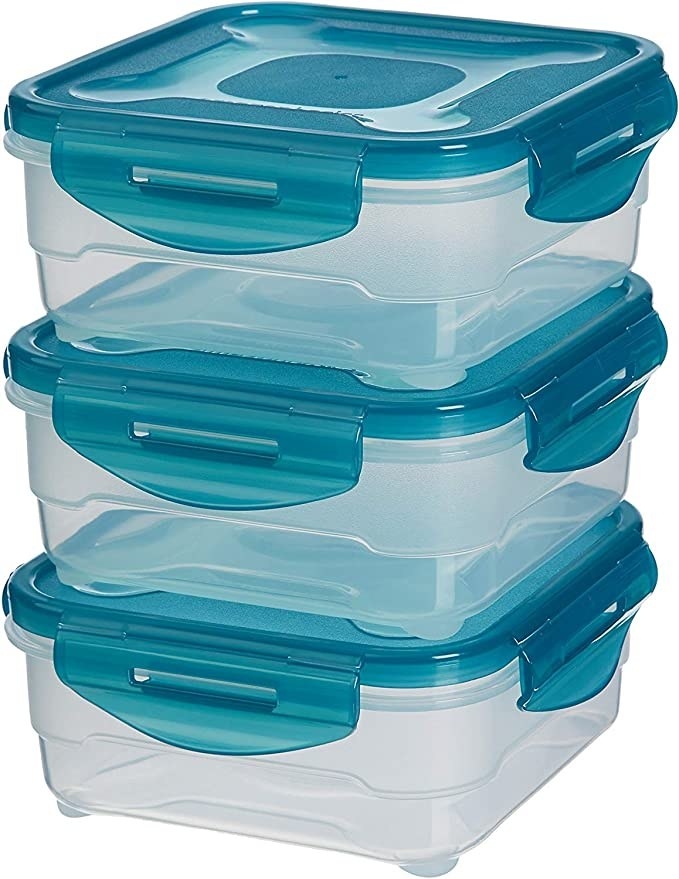 Transparent storage containers with blue lids.