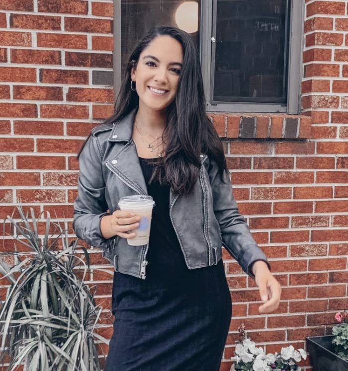 reviewer wearing the charcoal grey faux suede jacket
