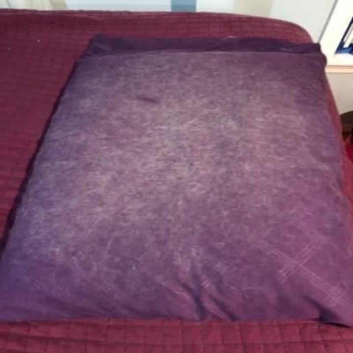 A pillowcase covered in pet fur
