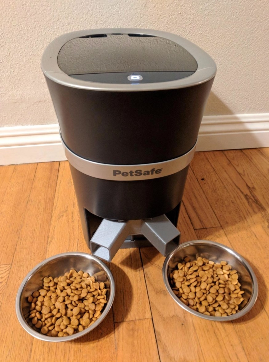 The automatic pet feeder with two full bowls of food
