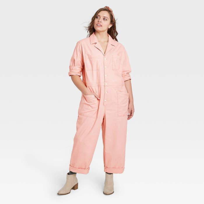 model wearing pink jumpsuit